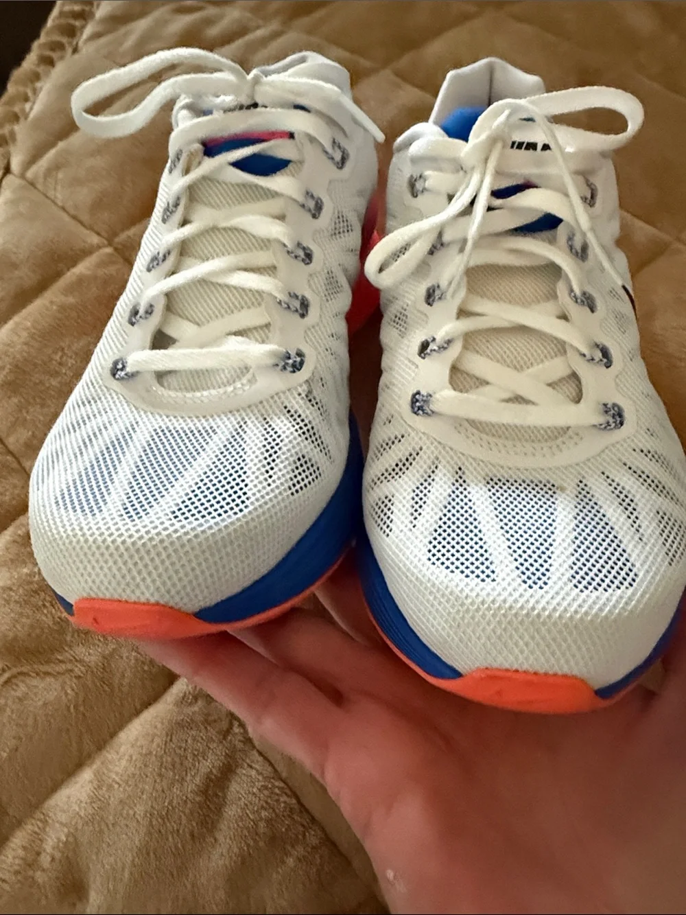Nike Women's White Running Shoes with Blue and Pink Accents